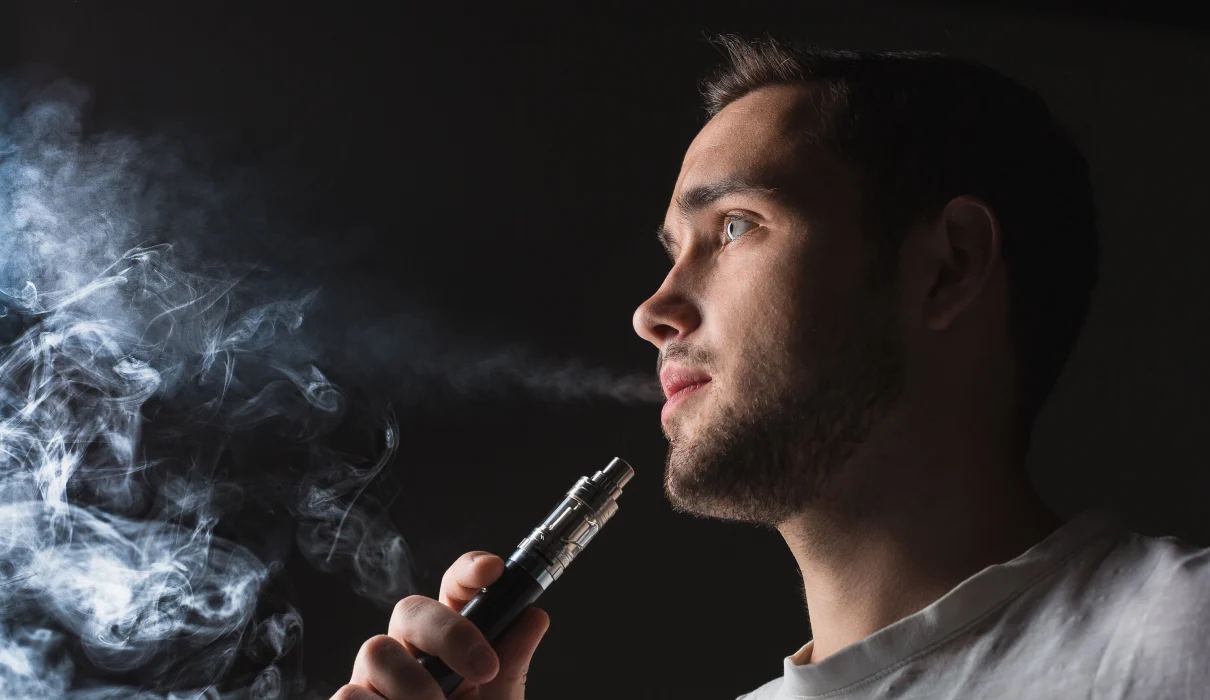 Image showing a person vaping with text overlay 'Vaping Without Nicotine for Anxiety: Finding Calm in Nicotine-Free Options'.
